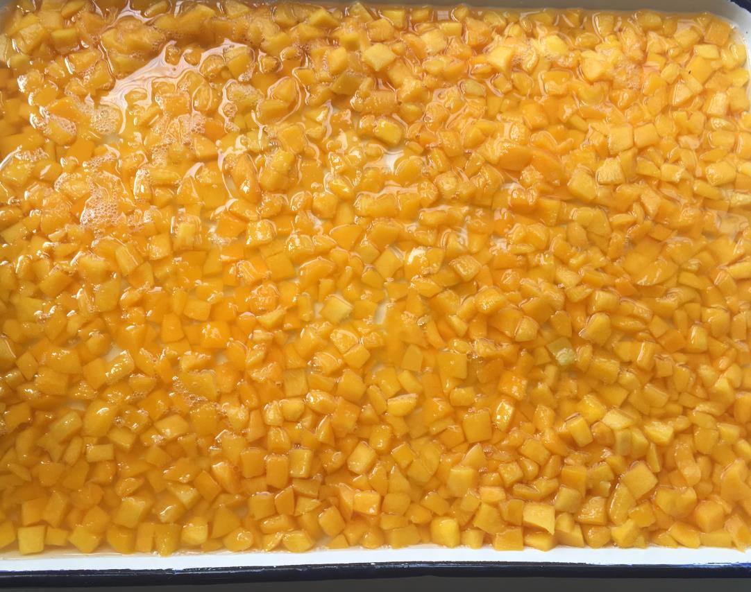 Canned yellow peach diced in light syrup